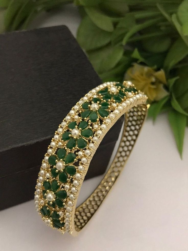 Material:  brass, CZ Stones, Pearl  Suitable for any kind of outfit like lehenga Kurtis Denims Sarees and Gowns.  Suitable for any occasions and ceremonies.  Arrives in a small plastic box.  Best gift for your anniversary. Best gift for her Birthday. Bracelet : 1 Emerald Bangles, Sari Lehenga, Bracelet Indian, Sabyasachi Jewellery, Cubic Zirconia Bracelet, Birthday Bracelet, Bracelet Diamond, Emerald Bracelet, Best Gifts For Her