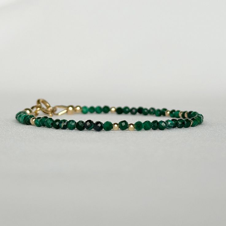 "Discover my minimalist and exquisitely natural emerald green malachite bracelet, elegantly made with 14k gold-filled or sterling silver accents, clasp and findings. This versatile gemstone beaded bracelet is perfect for layering or wearing on its own, achieving a minimalist aesthetic. A timeless jewelry piece that doubles as an ideal gift choice for engagements, weddings, birthdays, or anniversaries, suitable for moms, friends, girlfriends, teachers, or self-indulgence. DETAILS * Transformation Minimalist 14k Gold Filled Dangle Jewelry, Dainty 14k Gold Jewelry With Natural Stones, Everyday 14k Gold Filled Bracelet, Faceted 14k Gold Round Jewelry, Adjustable Gold Gemstone Jewelry, Spiritual Round Beads Jewelry For Gift, Spiritual Round Beads Jewelry Gift, Spiritual 14k Gold Gemstone Jewelry, Spiritual Yellow Gold Jewelry With Gemstones