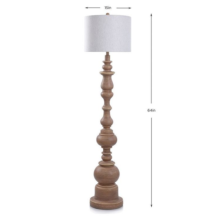 a tall wooden lamp with a white shade on the top and bottom half of it