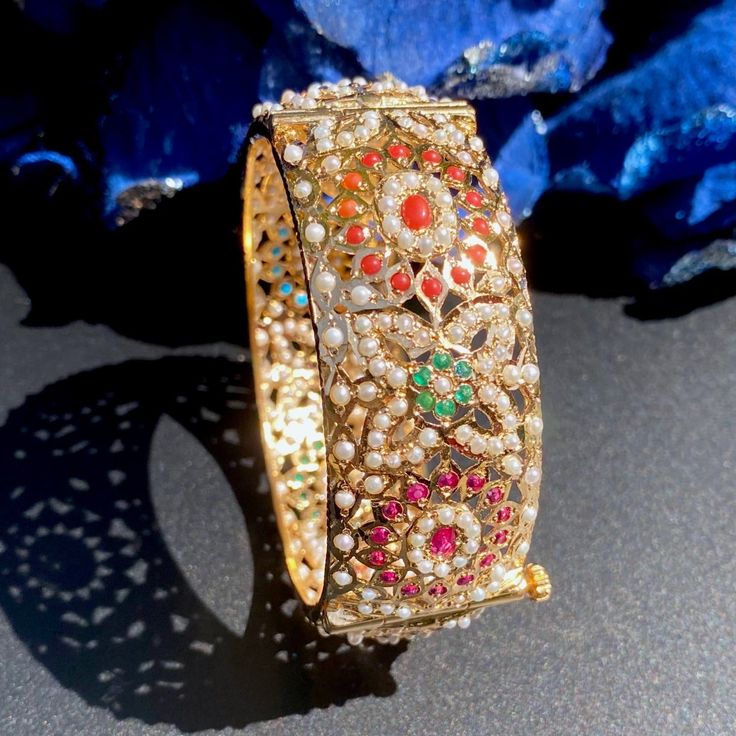 jadau bangle Multicolor Wedding Bangle With 17 Jewels, Festive Gemstone Bangle For Festivals, Elegant Multicolor Openable Bangle, Temple Jewelry Bangle With Gemstones For Festivals, Festive Gemstone Bangle, Gold Bangle Pearl Bracelet In Temple Jewelry Style, Traditional Pearl Bangle Bracelet As Gift, Traditional Pearl Bangle Bracelet For Gift, Gold Temple Jewelry Pearl Bangle Bracelet