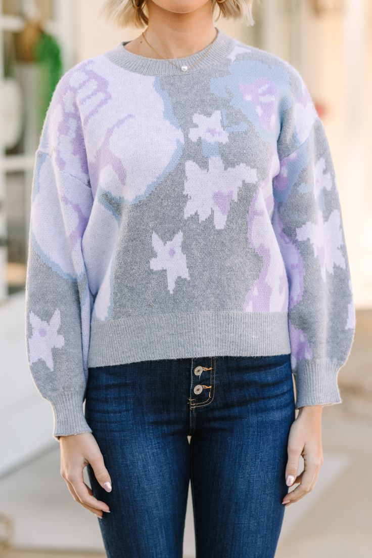 How cute is this sweater?! The colors in that floral print are so soft and look fabulous together. This sweater is perfect for the spring and is going to look great with your favorite jeans. Round neckline Long sleeves Floral print Generous stretch Payton is wearing the small. Floral Print Sweater For Fall, Chic Purple Spring Sweater, Chic Purple Sweater For Spring, Casual Printed Sweater For Spring, Spring Trendy Jacquard Knit Sweater, Trendy Spring Crew Neck Sweater, Trendy Spring Jacquard Knit Sweater, Casual Knit Sweater With Floral Print, Trendy Crew Neck Sweater For Spring