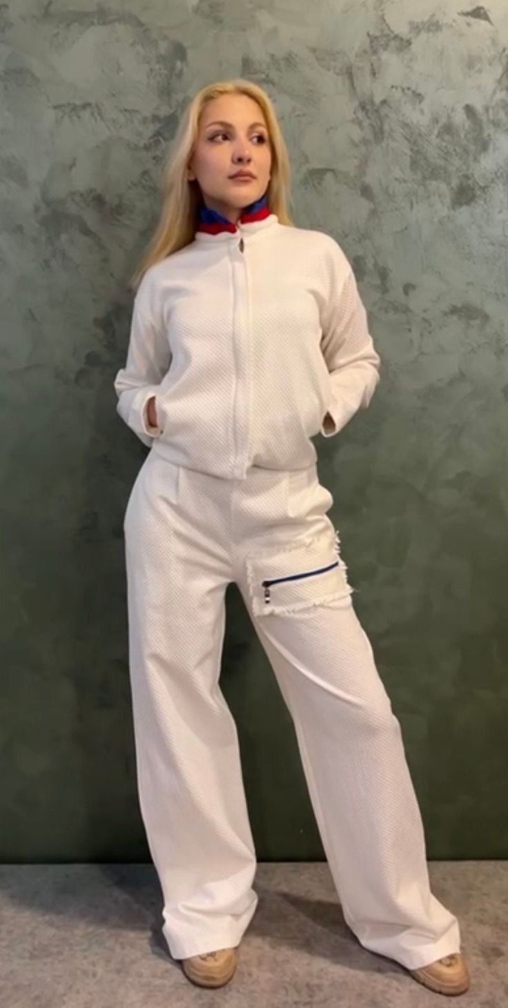 Made of Turkish Jakarta fabric, slightly cropped, hooded, zip up , white with a few blue and red accents. White Cotton Sporty Tracksuit, White Long Sleeve Sporty Tracksuit, White Cotton Tracksuit For Sports, White Stretch Tracksuit For Sportswear, White Tracksuit With Pockets For Sports, White Sportswear Tracksuit For Loungewear, White Hoodie With Pockets For Loungewear, White Cotton Tracksuit With Drawstring Hood, White Stretch Tracksuit For Winter