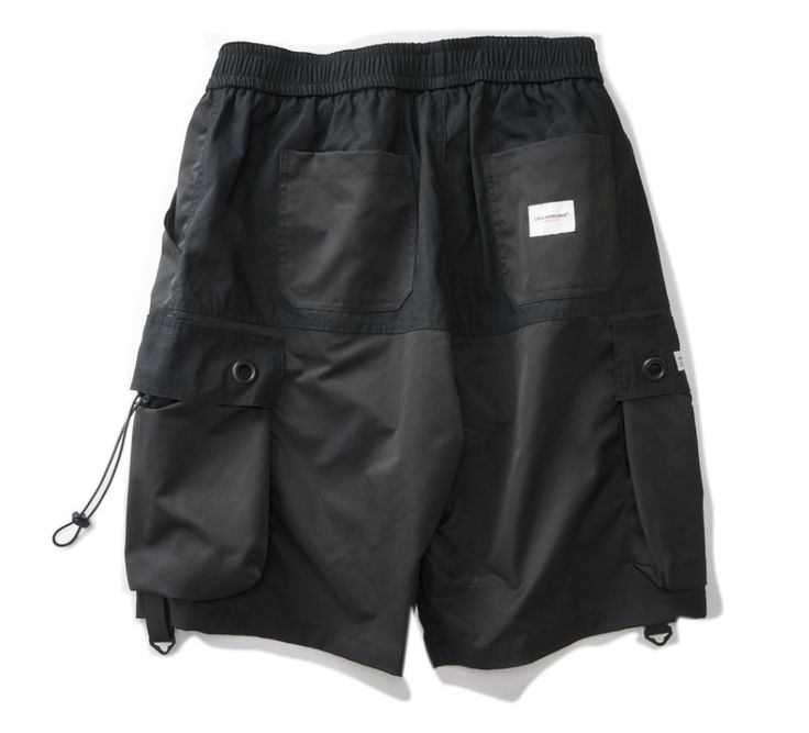 Stay agile in the city with our lightweight men's cotton shorts. Unveiling our latest addition to the urban wardrobe - our utility jogger shorts for men, the definitive staple for every trend-forward city-dweller. Crafted to be lightweight and comfortable, these urban shorts are, in essence, your summer armor. They come equipped with two black straps and drawstrings on each cargo pocket, lending an enhanced tactical vibe to your appearance. This feature adds an extra layer of sophistication and Summer Techwear Shorts With Functional Pockets, Urban Style Shorts With Side Pockets For Outdoor, Urban Shorts With Side Pockets For Outdoor, Urban Outdoor Shorts With Side Pockets, Streetwear Cargo Pocket Shorts, Urban Style Cargo Shorts For Outdoor, Streetwear Cargo Shorts With Functional Pockets, Techwear Cargo Shorts For Streetwear With Functional Pockets, Streetwear Shorts With Functional Pockets