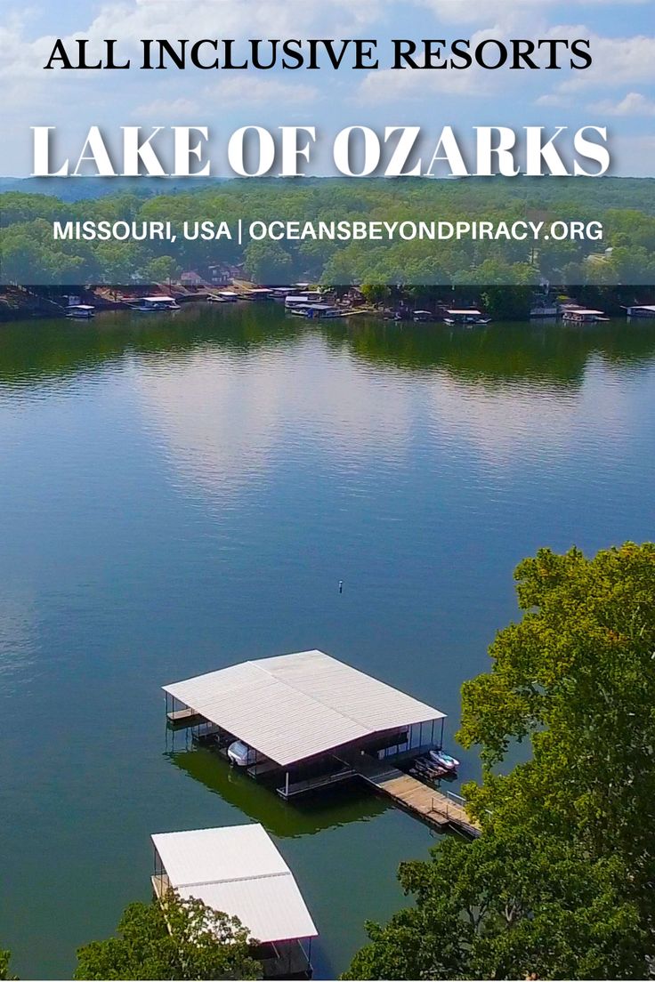 an image of a lake that is surrounded by trees and the words lake of ozarks