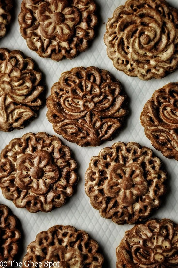 some cookies are sitting on a white tray