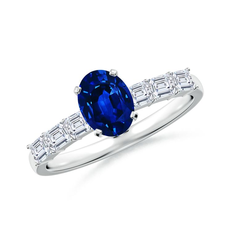 a blue sapphire and diamond ring with baguets on the side, set in white gold