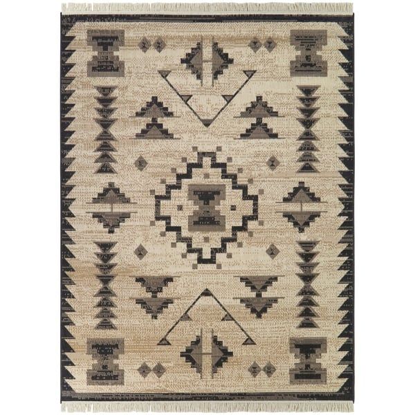 an old navajo rug with black and white designs on the front, in neutral tones