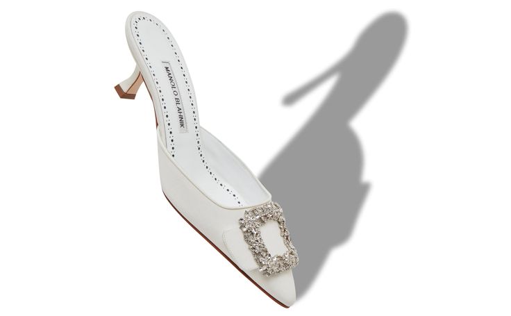 Designer White Crepe de Chine Jewel Buckle Mules - Image Main Elegant Mules With 4-inch Heel And Pointed Toe, Elegant White Kitten Heels With Single Toe Strap, Elegant Square Toe Mules With Heel Loop, Elegant Closed Toe Mules For Evening, White Single Toe Strap Kitten Heels For Formal Occasions, Elegant White Mules With 4-inch Heel, Wedding Heels With Sculpted Heel And Single Toe Strap, Elegant High Heel Mules For Gala, Elegant Formal Wedding Shoes With Heel Loop