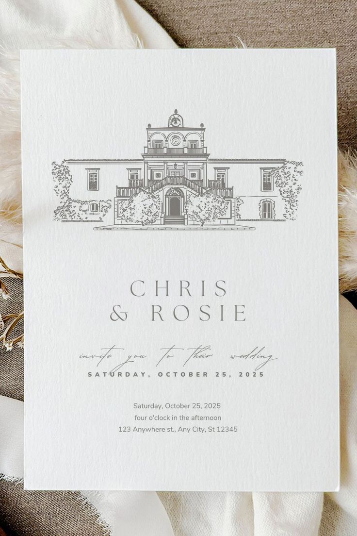 a white wedding card with the words, christ and rose on it