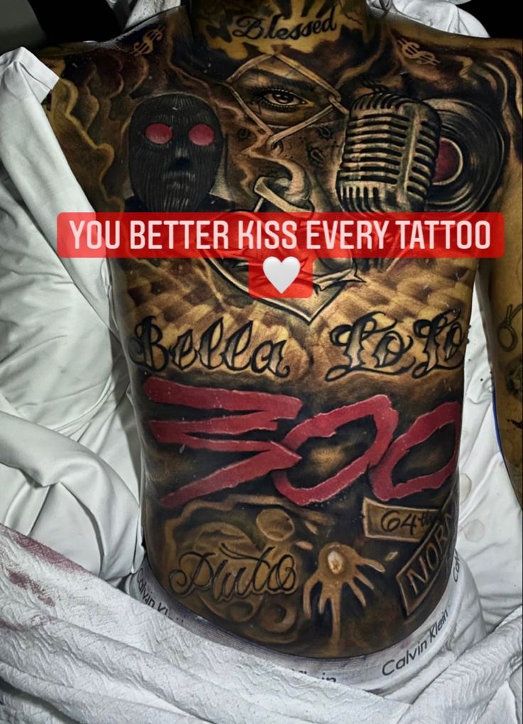 a man with tattoos on his back and the words, you better kiss every tattoo