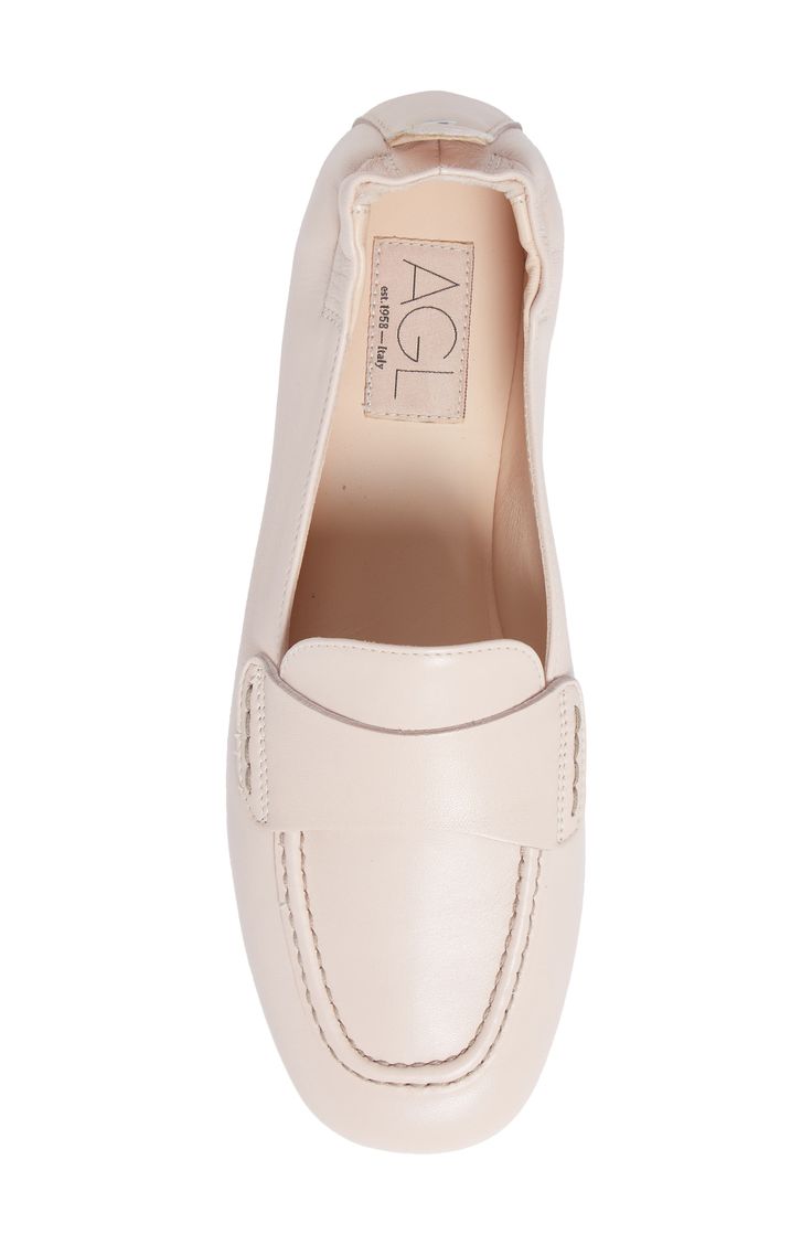 An elasticized topline softens the sophisticated appeal of a supple leather loafer with a moc-stitched toe. Leather upper and lining/leather and rubber sole Made in Italy Women's Shoes Beige Leather Sole Slip-ons For Work, Slip-on Loafers With Textured Sole And Flat Heel, Office Slip-ons With Textured Sole And Almond Toe, Business Casual Plain Toe Slip-ons For Spring, Spring Business Casual Plain Toe Slip-ons, Spring Business Casual Flat Slip-ons, Classic Round Toe Slip-ons For Spring, Classic Beige Slip-ons For Fall, Leather Slip-ons With Almond Toe For Office