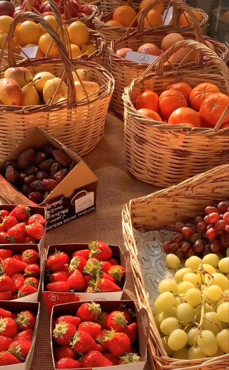 baskets filled with lots of different types of fruit