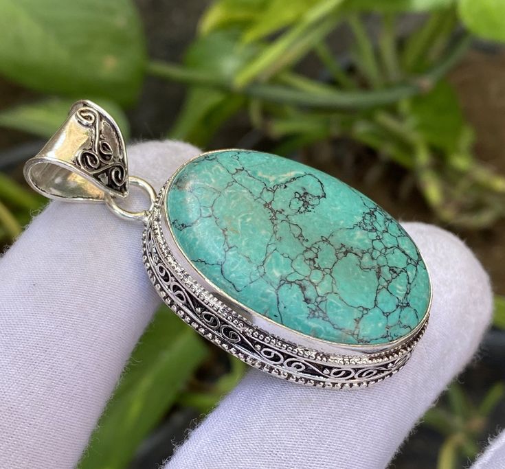 ♥ The most unique jewelry you can find, a perfect gift for you and your loved one ♥ * PRODUCT INFORMATION ● Gemstone : Turquoise ● Pendant Length : 5.1cm ● Metal : Sterling Silver ( 925 With Stamp ) ● Plating: 925 parts per 1000 ● Stone Shape : Same As Picture ● Stone Category : Cabochons ● Silver Polish : High ❏ Care instructions 1-: Put Jewelry On After Applying Makeup 2-: Don't Wear Jewelry In Swimming Pools And 3-: Contact Sports and Jewelry Don't Mix 4-: Remove Your Jewelry Before Bathing 5-: Use Jewelry Polishing Cloths for Best Results 6-: Use Warm Water to Clean Jewelry 7-: Inspect Your Jewelry Regularly8-: When Traveling with Jewelry, Use a Case * Benefits Of Wearing Silver As a metal, silver has significant health benefits that have been used across cultures for centuries. Silver Artisan Turquoise Necklace Nickel Free As Gift, Turquoise Round Pendant With Large Stone, Turquoise Jewelry With Large Round Stone Pendant, Turquoise Gemstone Oval Pendant Jewelry, Turquoise Sterling Silver Pendant Gemstone, Turquoise Pendant Gemstone In Sterling Silver, Turquoise Pendant In Sterling Silver, Bohemian Turquoise Gemstones In Sterling Silver, Turquoise Oval Pendant Jewelry Gift