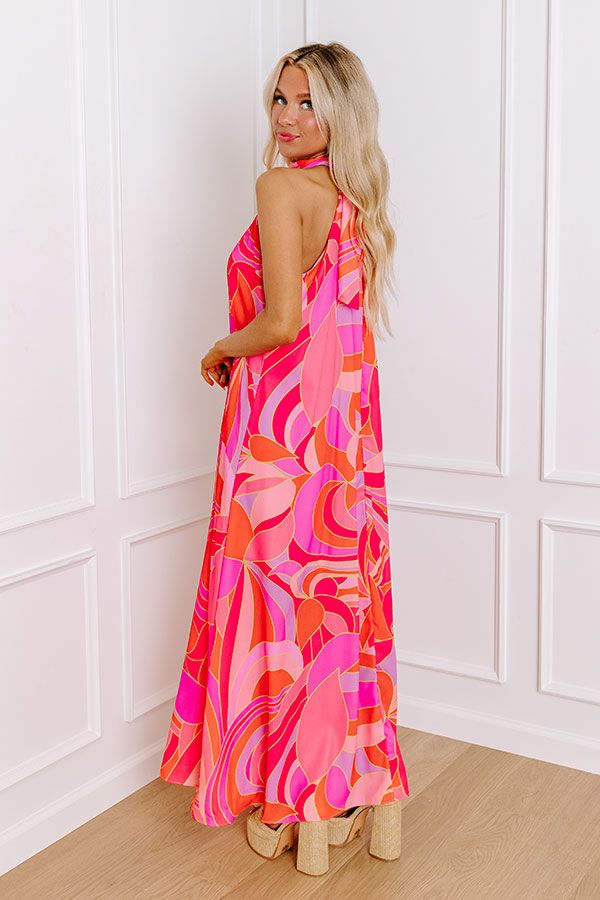 - Be as bold as you are fabulous in this vibrant maxi! Effortlessly chic with its flowy sleeveless cut, this dress is a celebration of vibrant hues. Its a perfect choice for making a statement at any occasion. Own the moment with this captivating dress! - Airy chiffon material with an abstract print featuring vibrant pinks, purples, orange, and yellow hues - A built-in lining ending above the knee - A mock neckline with back tie closure and a keyhole detail - A sleeveless cut - A relaxed silhoue Pink Halter Neck Maxi Dress For Summer, Bold Dresses For Spring Vacation, Vibrant Summer Maxi Dress For Parties, Vibrant Summer Party Maxi Dress, Summer Party Vibrant Maxi Dress, Bold Summer Vacation Dresses, Vibrant Print Sundress Maxi Dress For Party, Pink Flowy Maxi Dress For Summer, Pink Sleeveless Maxi Sundress