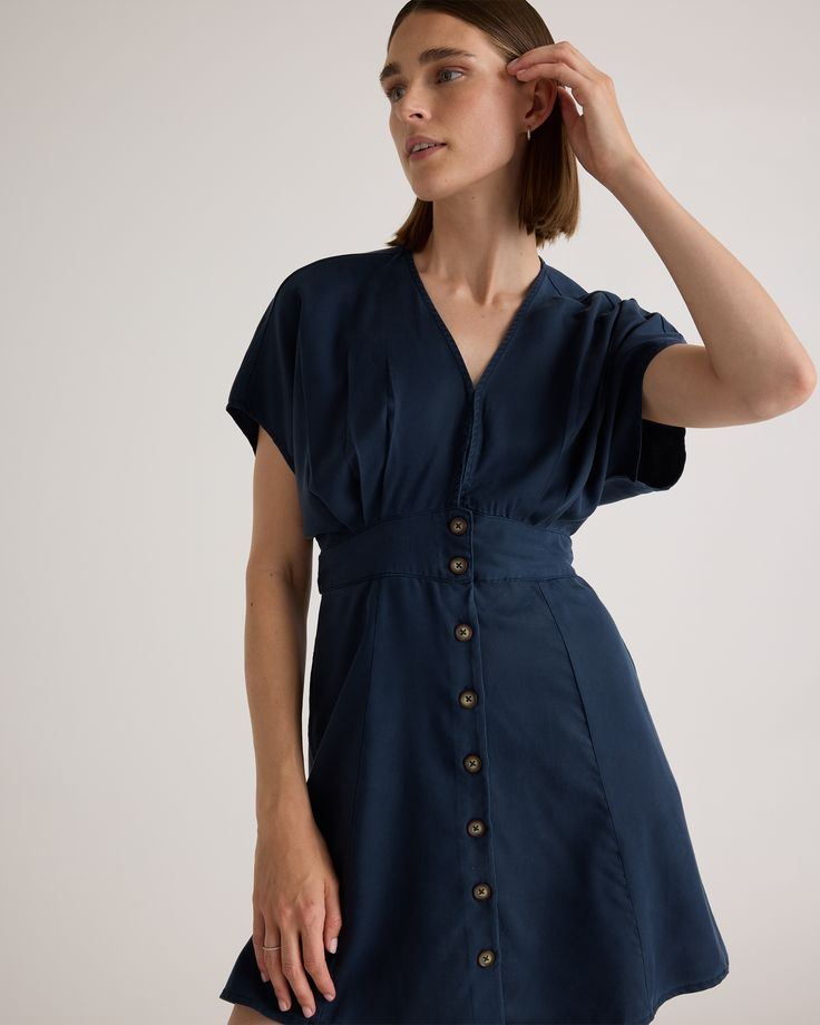 You finally found the perfect everyday summer dress. This soft, breezy, A-line dress buttons up the front, ties at the waist, and even has a hidden clasp (you know, for those days that require a little modesty).  | Quince | Women's Vintage Wash Tencel Button Front Dress in Midnight Blue, Size Medium Mini Dresses With Tie Fastening For Daywear, Mini Dress With Tie Fastening For Daywear, Tie Fastening Mini Dress For Daywear, Summer Mini Length Belted Dress For Date Night, Summer Belted Dress For Daywear, Summer Mini Belted Dress For Date Night, Summer Daywear Belted Dresses, Summer Date Night Mini Belted Dress, Summer Short Sleeve Belted Dress