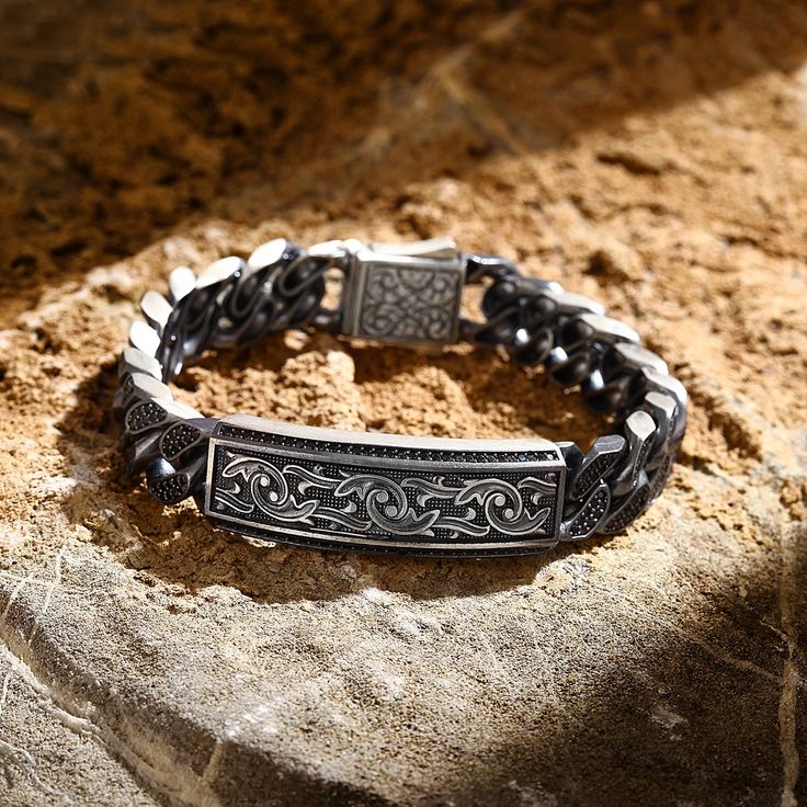 ⭐ 40% OFF until end of April! Grab this deal now! ⭐ This striking heavy masculine silver bracelet has been meticulously hand-engraved with intricate detailing, making it a truly unique piece of jewelry. Crafted from high-quality sterling silver, this bracelet is designed to be bold and eye-catching, perfect for making a statement. With its sturdy construction and substantial weight, this bracelet is perfect for the modern man who wants a piece of jewelry that's both stylish and durable. The intr Father's Day Engraved Silver Bracelets, Silver Engraved Chain Bracelet For Father's Day, Engraved Silver Chain Bracelet For Father's Day, Masculine Silver Jewelry With Stainless Steel Clasp, Masculine Silver Bracelets As A Gift, Masculine Silver Bracelets With Stainless Steel Clasp, Masculine Silver Jewelry Gift, Engraved Bracelet Silver, Men Silver Jewelry