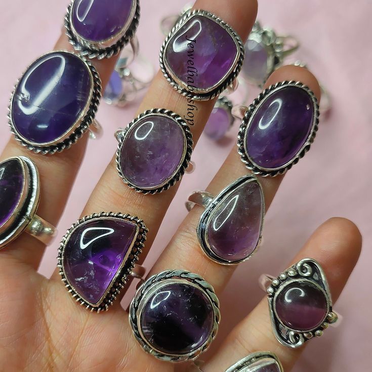 50pcs Amethyst ring, 925 sterling silver plated ring, birthstone ring, boho ring lot, gift for women, handmade ring, ring, crystal ring ------------------------------------------------------------------------- Gemstone - Amethyst Stone Type - Natural Material - Brass / Gemstone Polish - 925 Silver Polish Stone Colour - Purple Use For - Women / Girls ---------------------------------------------------------------------------- Shipping Time -  Normal Shipping - 10-15 Working Days Express Shipping Bohemian Sterling Silver Crystal Birthstone Ring, Silver Stackable Amethyst Rings, Silver Amethyst Bohemian Ring, Purple Spiritual Crystal Ring, Bohemian Silver Amethyst Ring In Sterling Silver, Bohemian Amethyst Crystal Ring In Silver, Handmade Sterling Silver Toe Ring, Adjustable Bohemian Amethyst Ring In Sterling Silver, Bohemian Silver Amethyst Ring With Natural Stones