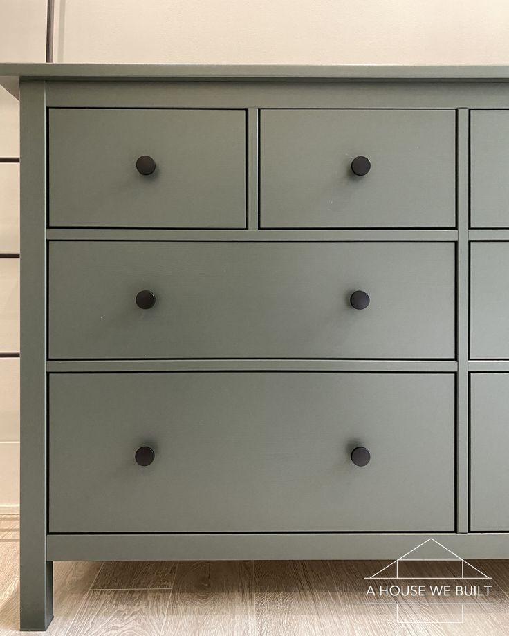 a large gray dresser with six drawers on each side and one drawer at the top