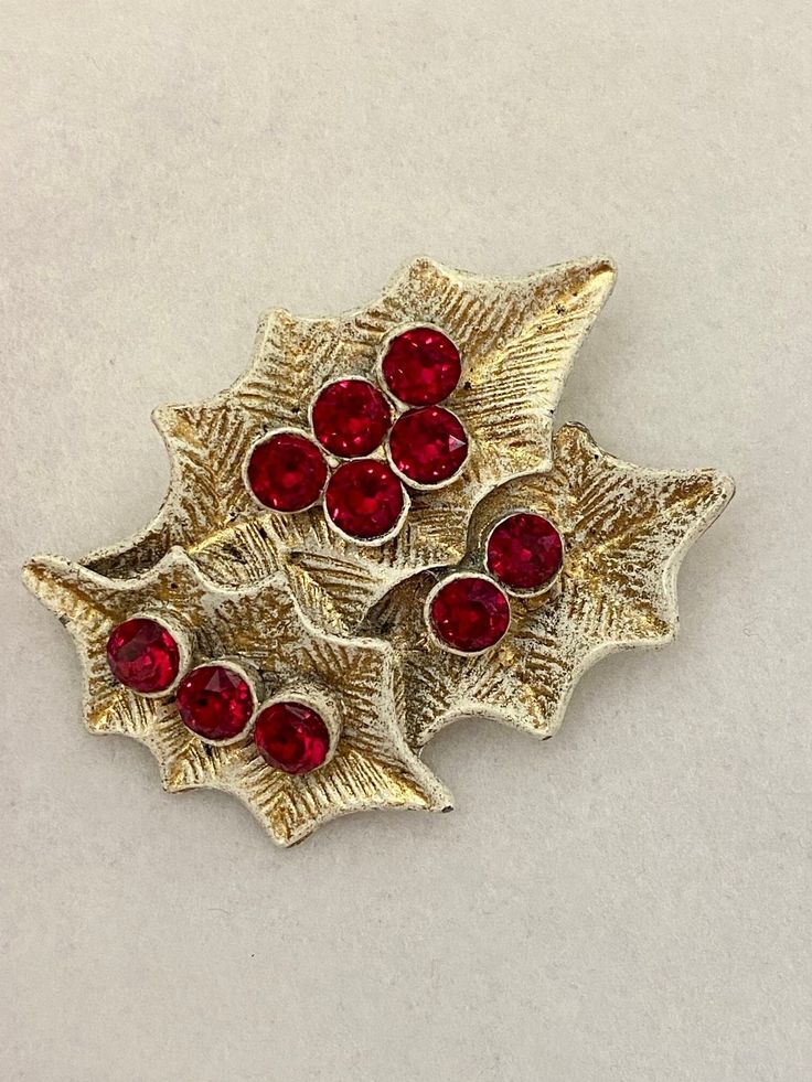 Dodds Holly Leaves Red Berries Vintage Holiday Costume Brooch.  In excellent and unworn condition, a substantial 1950s Christmas pin measuring 2 1/4" wide by 1 3/4" tall.  The gold tone plate and sparkling Holly red rhinestones are bright and sparkling. The pin back is straight and strong, the clasp locks securely. Will come wrapped in a cellophane gift bag. Vintage Red Brooches For Festive Occasion, Red Vintage Holiday Jewelry, Vintage Red Pins For Gifts, Vintage Red Pins As Gift, Vintage Red Pins For Gift, Vintage Red Jewelry For Holidays, Red Vintage Jewelry For Holidays, Vintage Red Brooches For Party, Vintage Red Jewelry For Christmas