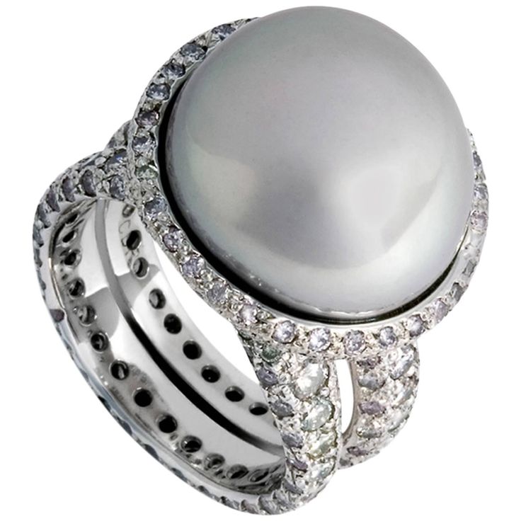 The ring in 18k white gold, diamonds 1,59 ct. and a grey-pink keshi pearl is definitley an eye - cather. Luxury Brilliant Cut Cubic Zirconia Pearl Ring, Silver Diamond Oval Pearl Ring, Silver Oval Diamond Pearl Ring, Silver High Luster Pearl Ring Fine Jewelry, Luxury High Luster Pearl Ring In Silver, Luxury High Luster Silver Pearl Ring, Fine Jewelry Silver Pearl Ring With High Luster, Silver Pearl Ring With High Luster, Luxury Silver Tahitian Pearl Ring