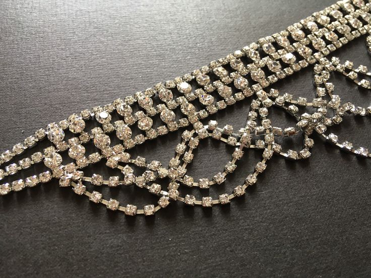 "Romantic choker necklace design just perfect to wear on your wedding day or any special event! We have also added an extra long cable chain finished at end for you to adjust the length. Color: silver with clear rhinestone crystals Size: choker measures around 15.75\" total long (including extra long cable chain) x 2.4\" center drop Item ship out with tracking number to you (around 10 to 14 business days for delivery). We also provide fast shipping service, around 3-4 business days delivery but Elegant Silver Necklace For Wedding, Wedding Metal Choker With Bling, Glamorous Adjustable Choker Necklace, Elegant Jewel Choker For Evening, Party Jeweled Choker Jewelry, Glamorous Silver Choker For Gift, Elegant Jeweled Choker For Evening, Glamorous Silver Metal Choker, Glamorous Bridal Necklace With Bling As Gift