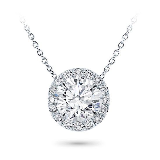 This halo pendant setting is stunning and can accommodate a round center diamond of your choice from 0.20-5.0ct. Pendant features approx. 18 G-H VS diamonds at approx. 0.20cttw. Metal options are 14k and 18k white and yellow gold, 18k rose, or platinum and includes a 16 chain. Classic Round Pendant Jewelry, Unique Diamond Pendant, Cushion Cut Solitaire, Round Diamond Pendant, Solitaire Diamond Pendant, Diamond Pendants Designs, Halo Necklace, Diamond Solitaire Necklace, Sparkly Things