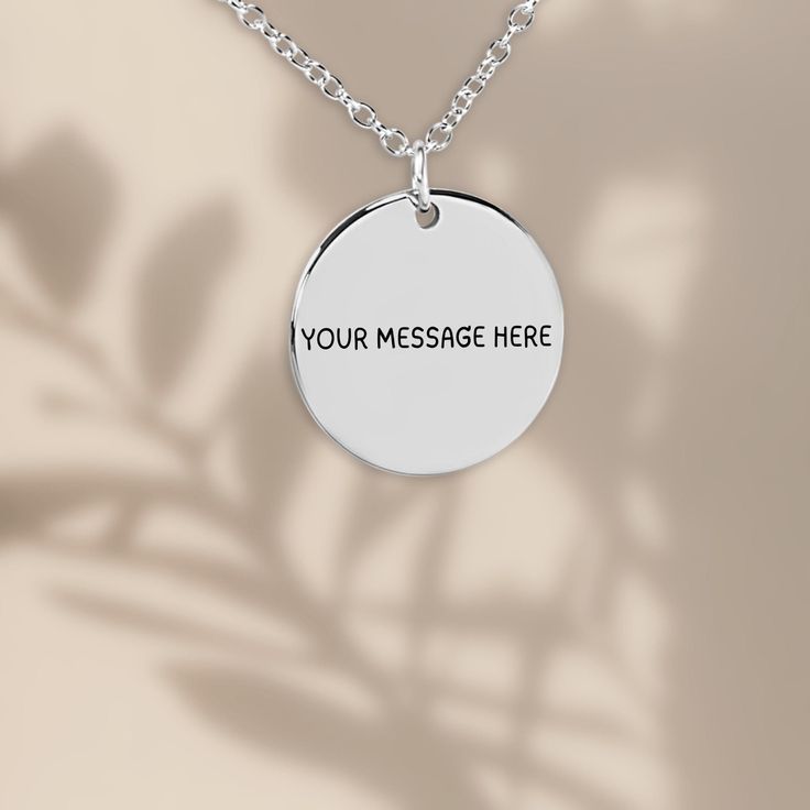 Capture the essence of your thoughts and sentiments with our Custom Message Necklace, thoughtfully crafted by NeatlyUniquely. This personalized piece of jewelry is a beautiful way to keep meaningful words close, transforming your special message into a wearable work of art. 🤍 PRODUCT DETAILS Material: Stainless steel with sterling silver plating  Necklace Length: 45+5 cm (17.7 + 2 inches) adjustable chain to fit your style perfectly. Pendant Size: 20 mm (0.79 in)showcasing a detailed engraving Round White Gold Charm Necklace As Gift, White Gold Round Charm Necklace As Gift, Round White Gold Charm Necklace Gift, Meaningful Round Pendant Jewelry As Gift, Minimalist Customizable Charm Necklaces As Gifts, Engraved Medallion Charm Necklaces As Gift, Spiritual Charm Necklaces With Round Pendant For Anniversary, Engraved Medallion Charm Necklace As Gift, Engraved Medallion Charm Necklace For Gift