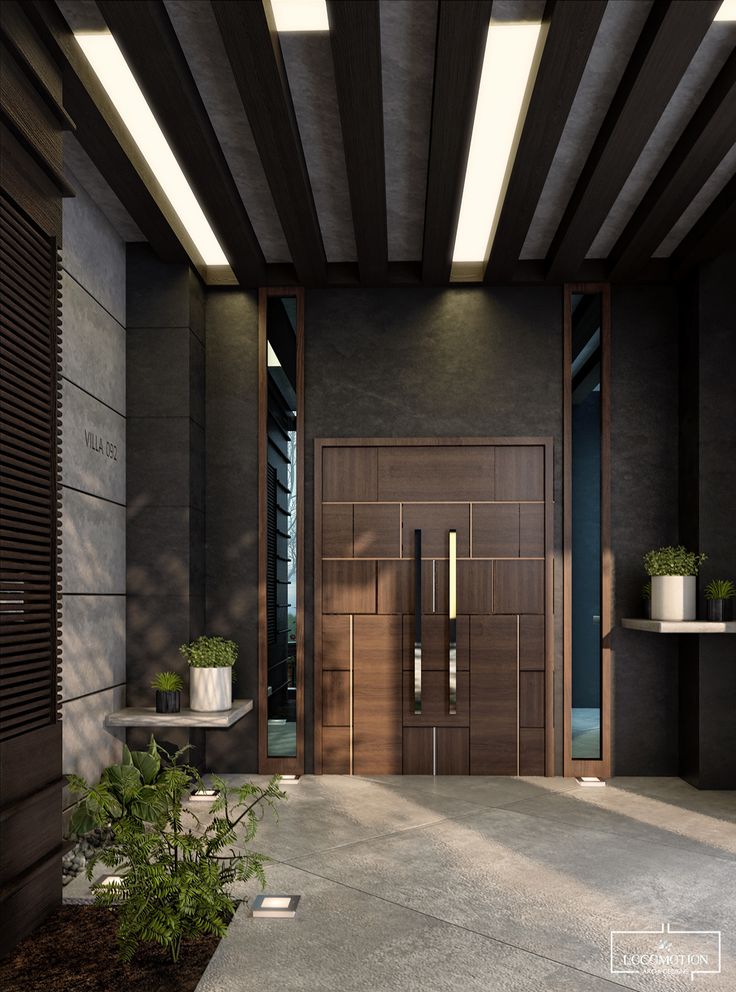 a modern entrance with wooden doors and planters