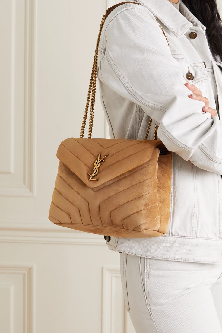 SAINT LAURENT's 'Loulou' bag is inspired by Loulou de la Falaise, the founder's friend and muse who embodied the Rive Gauche  haute bohémienne  of the '70s. Made from velvety-soft suede, this brown version features the signature chevron quilted finish and house's gilded logo plaque at the front. Ysl Loulou Bag, Ysl Handbags, Suede Outfit, Latest Bags, Saint Laurent Bag, Small Quilts, Brown Bags, Small Shoulder Bag, Womens Purses