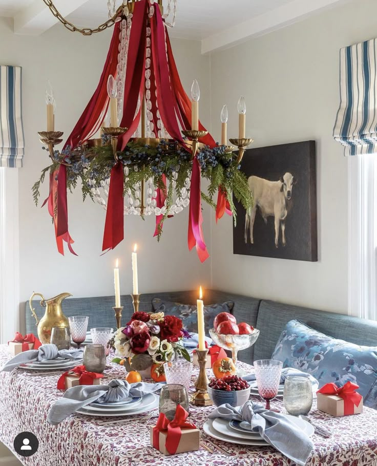 a dining room table set for christmas dinner