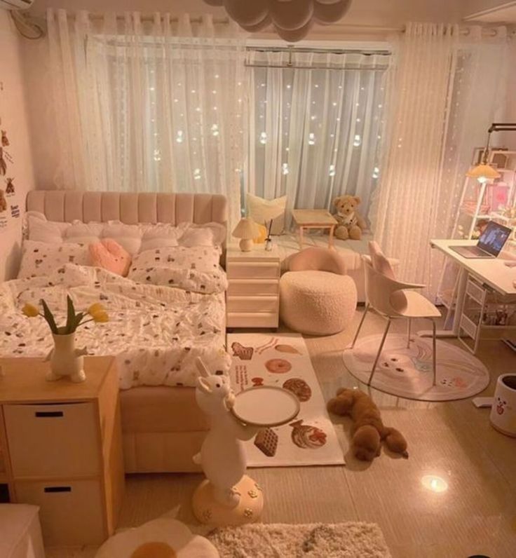 a bedroom with teddy bears on the floor and lights in the window behind it,