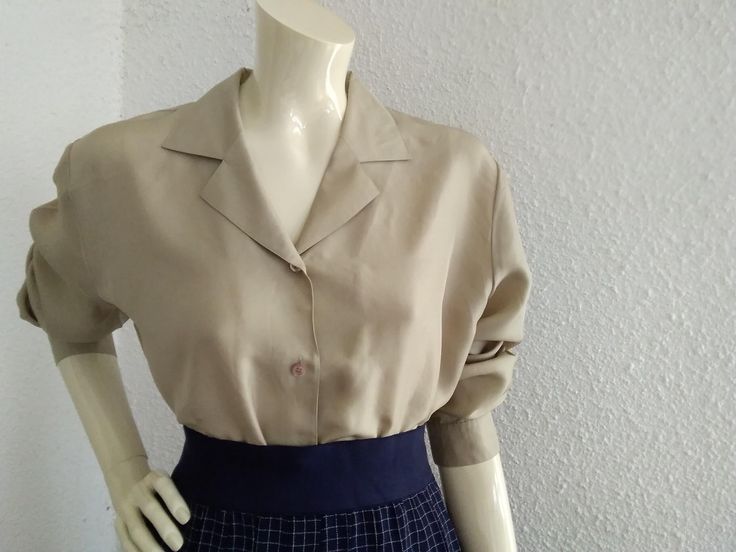 80s pure silk blouse ,minimalist simple blouse ,button up shirt ,notched collar,elegant statement blouse, spring blouse ,dark beige neutral color blouse ,42  EU size. GERRY WEBER -Brand measurements lying flat : shoulders :41cm ( 16 inches) bust :54 cm ( 21 inches) total length :65cm (25,5 inches) sleeve length :61 cm (24 inches) Chic Collared Top For Semi-formal Occasions, Chic Beige Blouse With Collar, Chic Semi-formal Tops For Summer, Chic Semi-formal Summer Tops, Elegant Beige Collared Top, Beige Collar Blouse For Office, Summer Beige Top With Lapel Collar, Vintage V-neck Tops For Workwear, Elegant Beige Semi-formal Tops