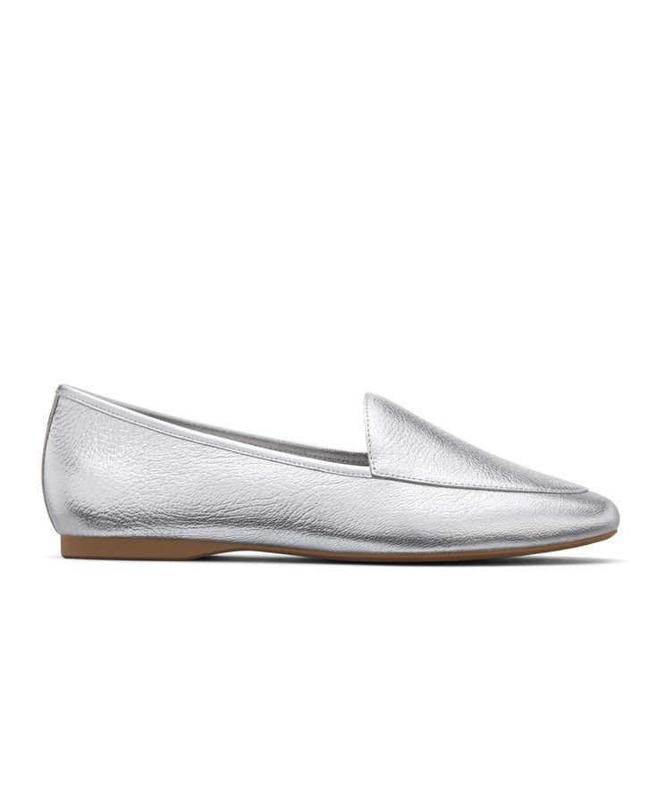 Classic loafers, reinvented. The understated silhouette of our Vesper is elevated with tumbled metallic Nappa leather. High shine and a sleek design allows this striking silver shade to catch the light as you walk. This uniquely relaxed loafer has a flexible toe and heel reinforcement so that you feel supported with every step. We lined our footbeds with a soft breathable leather for added luxury and durability. | The Vesper - Silver Leather Birdies Flats Silver Leather Slip-on Flats, Silver Slip-on Flats With Removable Insole, Casual Silver Leather Flats, Modern Silver Loafers With Round Toe, Silver Leather Flats For Formal Occasions, Formal Silver Leather Flats, Silver Leather Flats With Flat Heel, Silver Leather Almond Toe Flats, Silver Leather Flats For Spring