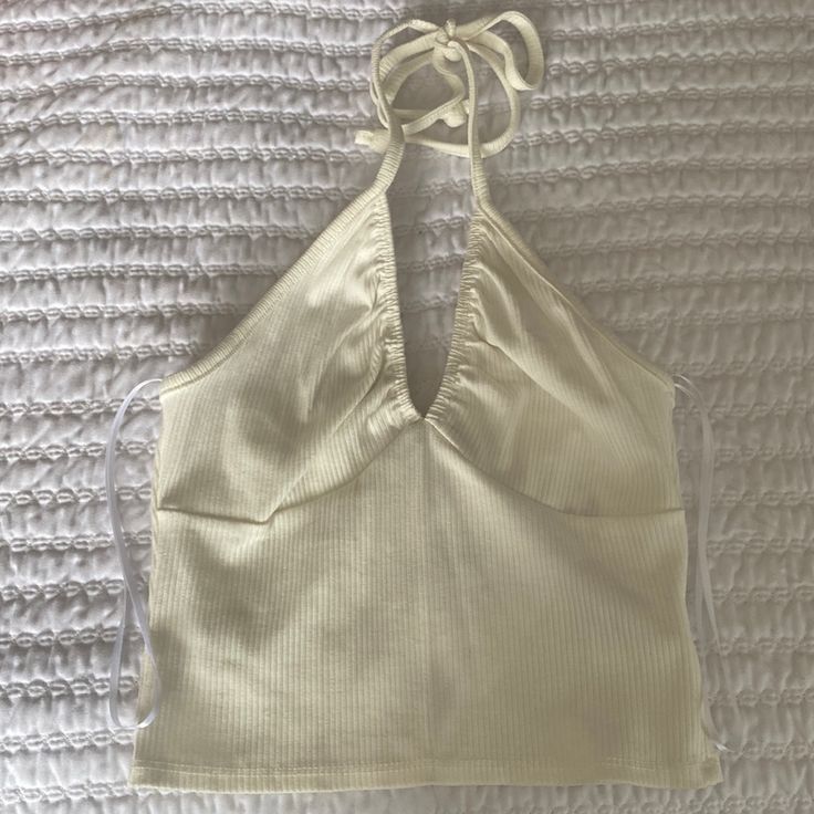 New With Tags. Urban Outfitters Ivory Halter Top. Size Xs White Fitted Halter Neck Top, White V-neck Crop Top For Spring, Beige Halter Neck Top For Day Out, Chic White Fitted Halter Top, Chic White V-neck Halter Top, White Fitted Halter Neck Crop Top, White Fitted V-neck Halter Top, Fitted White V-neck Halter Top, White Cotton Halter Neck Tank Top