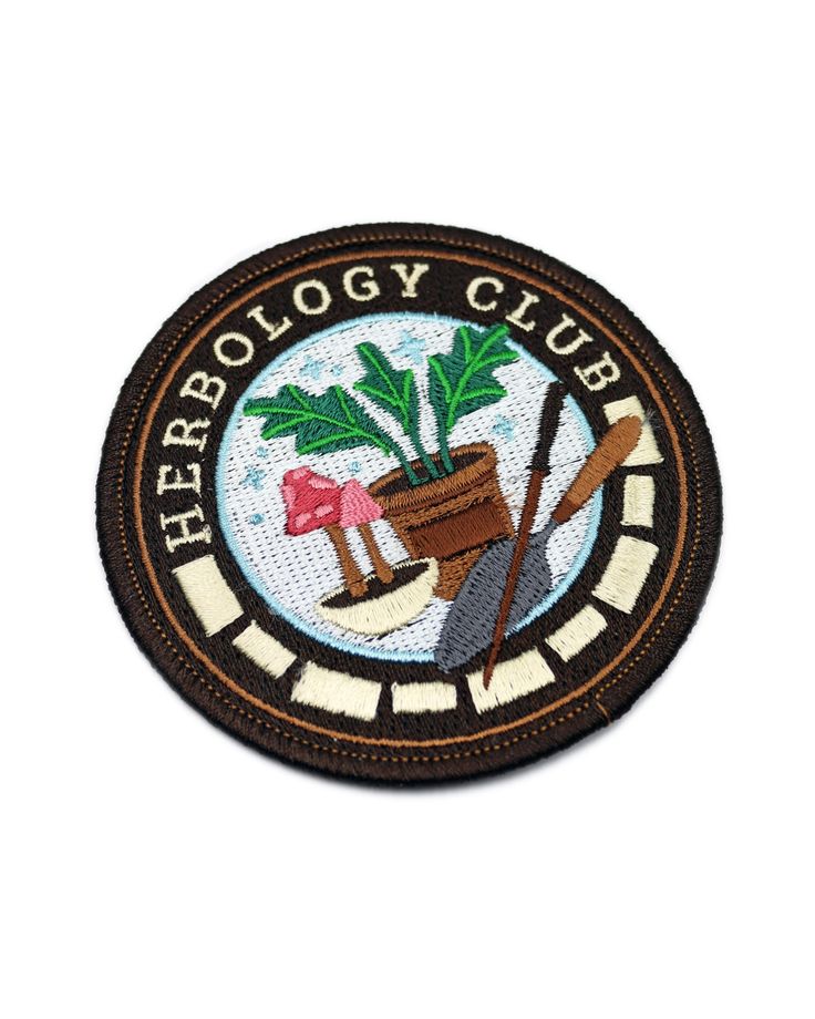 a patch with a potted plant and shovels on it, that says herb ecology club