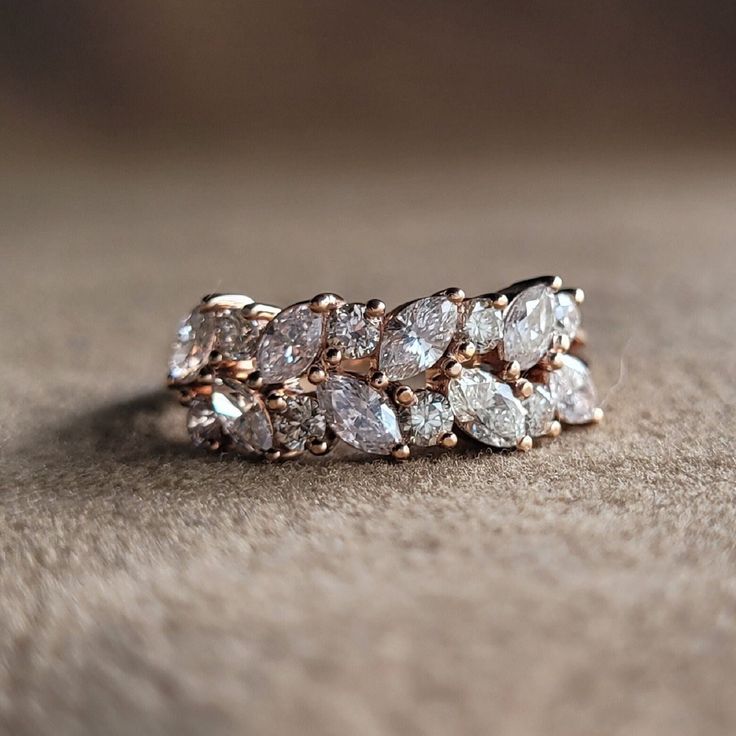 a diamond ring sitting on top of a table