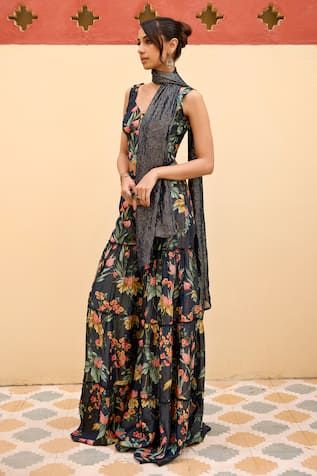 Navy blue blouse with all over floral garden prints. Paired with coordinating sharara and stole with beaded detailing. - Aza Fashions Summer Floral Print Saree Set, Bohemian Floral Print Sleeveless Sets, Bohemian Sleeveless Sets With Floral Print, Bohemian Sleeveless Floral Print Set, Floral Print Sharara For Summer Festivals, Multicolor Floral Print Sharara For Summer, Sleeveless Floral Print Festive Sets, Unstitched Floral Sharara For Summer, Fitted Sharara With Printed Motifs For Summer