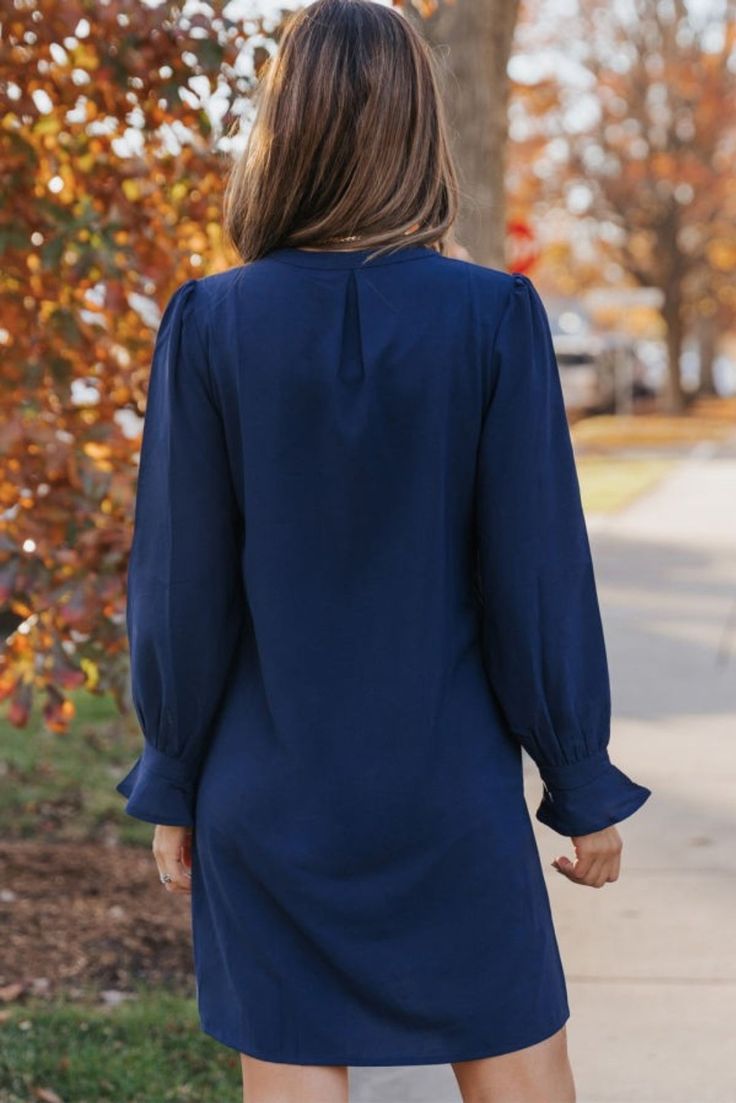 So versatile & flattering. Your all seasons go-to dress for work, church, to a dinner date or brunch. I have sold more than I can count and this navy color is my top seller. Perfect for travel too. Polyester Elegant Solid Color Mini Dress For Brunch, Chic Navy V-neck Mini Dress, Flattering Fall Workwear Dresses, Navy Midi Dress For Fall, Fall Midi Dress In Solid Color With Shift Fit, Modest Solid Color Dresses For Work, Solid Color Shift Midi Dress For Fall, Elegant Navy Midi Dress For Fall, Fall Solid Color Shift Midi Dress