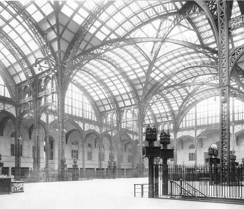 black and white photograph of an indoor train station