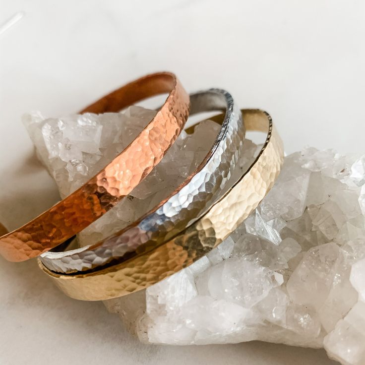 * These simple hammered cuffs are super versatile and great for layering and metal mixing! * Cuff measures approximately 6 x 1/4 inches * Adjustable - one size fits most * Brass and copper can darken and patina over time, but can be brought back to their original color with a polishing cloth or fine steel wool. For best results, take off when you shower and wash your hands. Materials: Brass, Copper, Aluminium (If worried about tarnishing or sensitivity, choose the aluminum silver!) Adjustable Hammered Cuff Bangle, Adjustable Hammered Cuff Bracelet, Adjustable Hammered Everyday Bracelets, Hammered Metal Bracelets, Everyday Hammered Cuff Bangle Bracelet, Metal Mixing, Bracelet Layering, Everyday Bracelet, Brass Cuff