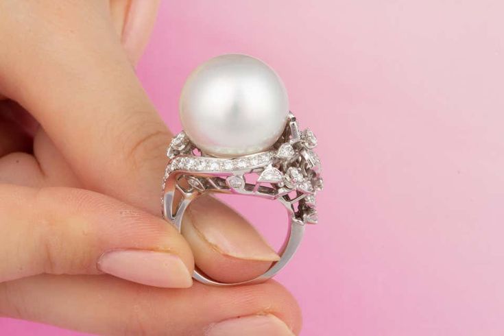 For Sale on 1stDibs - This South Sea pearl and diamond cocktail ring features a gem quality pearl of pinkish hues and 17.5mm diameter. The pearl is untreated. It displays a Elegant White Ring For Evening Occasions, Elegant White Ring For Evening, Elegant White Evening Ring, Luxury Diamond White Pearl Ring For Formal Occasions, Luxury White Rings With Pearl Drop, Luxury Pearl White Pearl Ring For Wedding, Luxury Pearl White Pearl Ring With Diamond Accents, Exquisite Pearl Ring With Diamond Accents, Luxury Pearl Ring For Evening