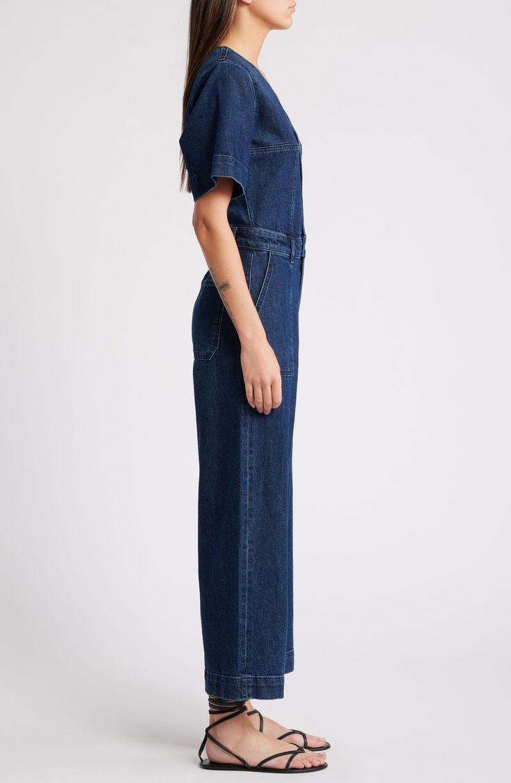 Make it one-and-done in a casual jumpsuit cut from dark-rinsed nonstretch denim. 52" length; 25" inseam; 23" leg opening (size Medium) Front button closure V-neck Short sleeves Front patch pockets 100% cotton Machine wash, tumble dry Imported Dark Wash Wide Leg Denim Jumpsuit, Relaxed Fit Full Length Denim Jumpsuit, Relaxed Fit High Rise Denim Jumpsuit In Medium Wash, Relaxed Fit Denim Overalls With Wide Leg, Wide Leg Dark Wash Denim Jumpsuit, Medium Wash Relaxed Fit Wide Leg Denim Jumpsuit, Dark Wash Wide Leg Jumpsuits And Rompers With Pockets, Dark Wash Denim Jumpsuit With Wide Legs And Pockets, High Rise Cotton Jumpsuits And Rompers In Dark Wash