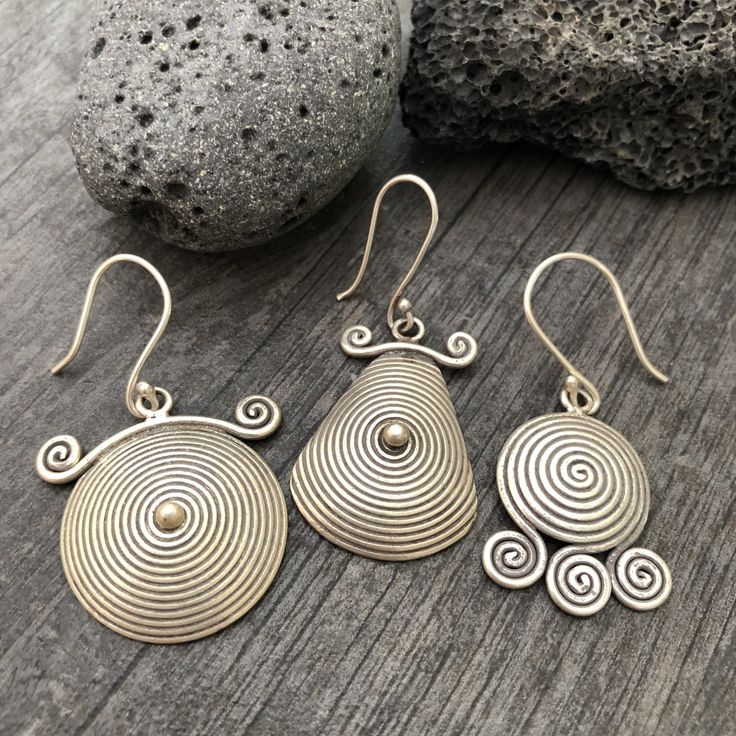 You can choose from 3 unique sterling silver earrings, made with round spiral shapes. 3 Different but unique spiral round silver earrings, perfect for your day by day outfits, easy to match any other accessories. Statement earring that are also light and easy to wear. You can see in one of the pictures there is a number that represents each pair. Pair 1- 2.5cm- 1 inch long 1.8cm- 0.75 inch wide It has a drop length of 4.3cm- 1.75 inch Pair 2- 3cm- 1.25 inch long 2cm- 0.90 inch wide It has a drop Unique Spiral Ear Wire Earrings, Unique Handmade Spiral Earrings, Silver Spiral Wrap Earrings, Pierced, Silver Spiral Earrings For Pierced Ears, Unique Spiral Earrings For Gift, Handmade Spiral Sterling Silver Wrap Earrings, Spiral Sterling Silver Earrings For Gift, Unique Spiral Earrings, Spiral Sterling Silver Earrings As Gift