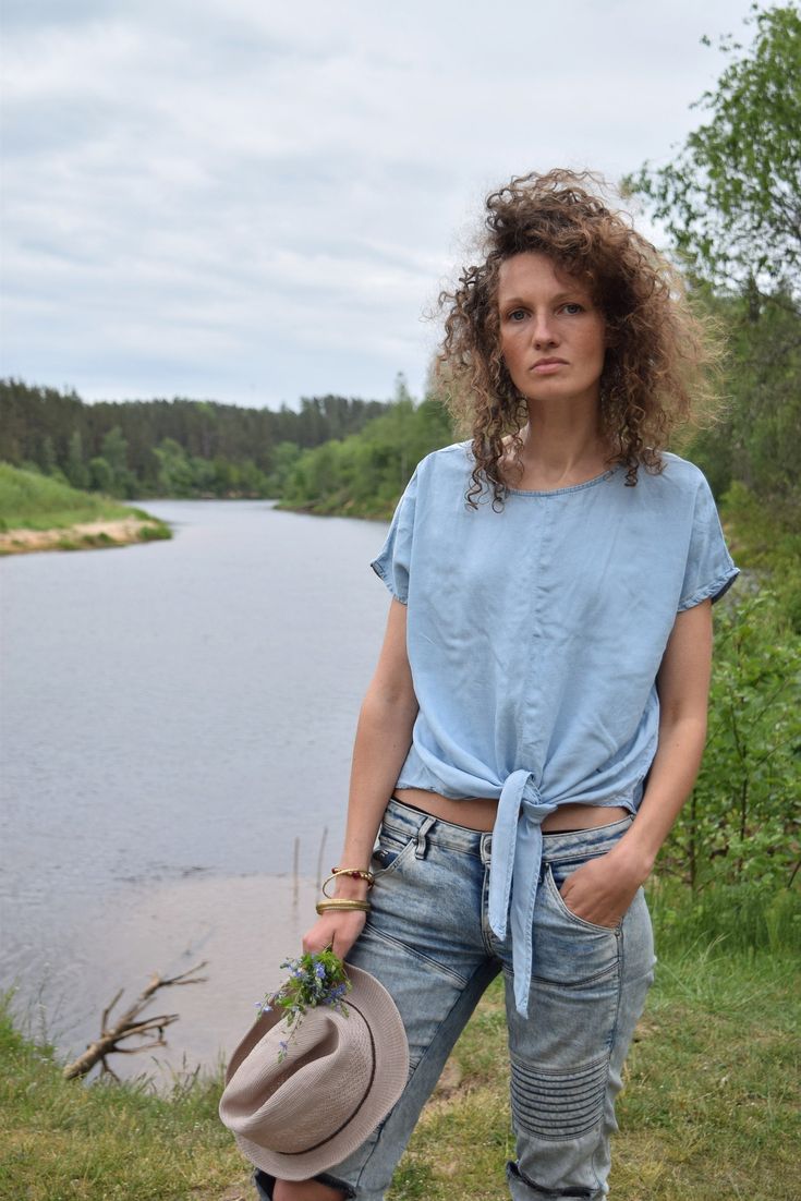 "Excellent denim blouse for your midsummer nights. It is not a mistake - buttons are on the back! Size: label says S, seems like women's (S) MEASUREMENTS: Length: 57 cm/ 22\" (without ties) Shoulder to shoulder: 50 cm/ 20\" Chest: 116 cm/ 46\" Condition: excellent Fabric: Lyocell Brand: unknown * Wash at temperature not higher than 30oC / 86oF Model wears: UK 8/ EU 36/ US 4 Model's height: 175 cm/5'7\" You can find more similar shirts here: https://www.etsy.com/shop/OnTheRoadStore?section_id=239 Summer Denim Blue Top With Short Sleeves, Short Sleeve Denim Top For Summer, Light Indigo Short Sleeve Denim Top For Summer, Denim Beach Top With Short Sleeves, Beach Denim Short Sleeve Top, Indigo Denim Shirt For Summer, Light Wash Short Sleeve Denim Top For Summer, Summer Indigo Denim Shirt, Indigo Short Sleeve Denim Top For Summer