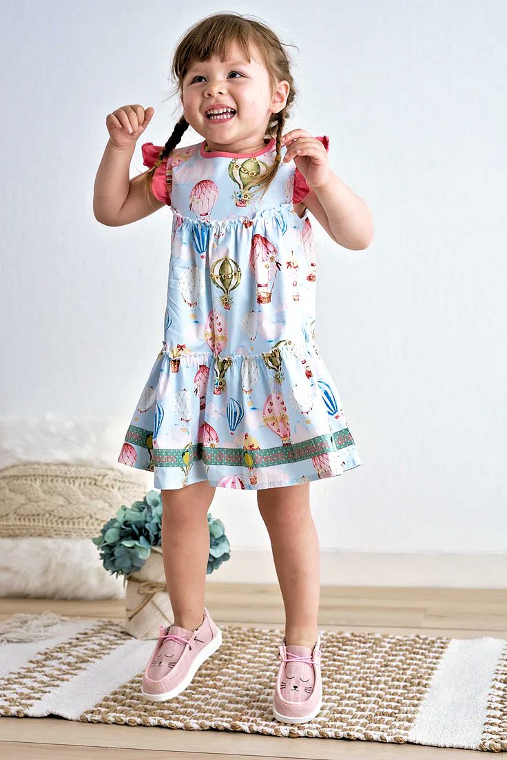 DESCRIPTION Experience a dreamlike moment with our Bella's balloon ruffle tiered dress, featuring a one-of-a-kind print and playful ruffles. Add a touch of quirkiness and stand out from the crowd with this fun and stylish piece. Blending cotton with spandex in baby garments can offer several benefits: Stretch and Flexibility: Spandex, also known as elastane, is a highly elastic fiber. When blended with cotton, it imparts stretchiness and flexibility to the fabric. Comfort: The combination of cot Ruffle Tiered Dress, Toddler Photography, Bleach Product, Baby Garments, Dress Birthday, Printed Balloons, Cotton Clothing, Wilmington Nc, Easy Dressing