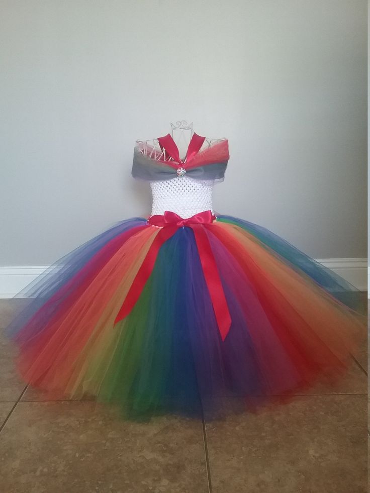 "This is a Over the Top Rainbow Tutu Dress size 12-24 Months to size 14. This dress is made with several layer of high quality tulle in rainbow colors. Please send measurement from arm pit to where you want the dress to hit at the bottom. This dress is very full and would be great for weddings or pictures. If you need a larger size just send me a message. Dress will not be floor length unless you send measurements. Size Chart for Dress Length (from armpit to bottom of dress): 12-24 Months------- Fitted Multicolor Tulle Dress, Multicolor Tulle Skirt Dress, Fitted Multicolor Tulle Princess Dress, Princess Style Multicolor Tulle Dress, Fitted Multicolor Princess Tutu Dress, Multicolor Tulle Skirt Tutu Dress For Dress-up, Multicolor Tulle Princess Dress For Dress-up, Multicolor Tulle Tutu Dress, Rainbow Fitted Tutu Dress For Party