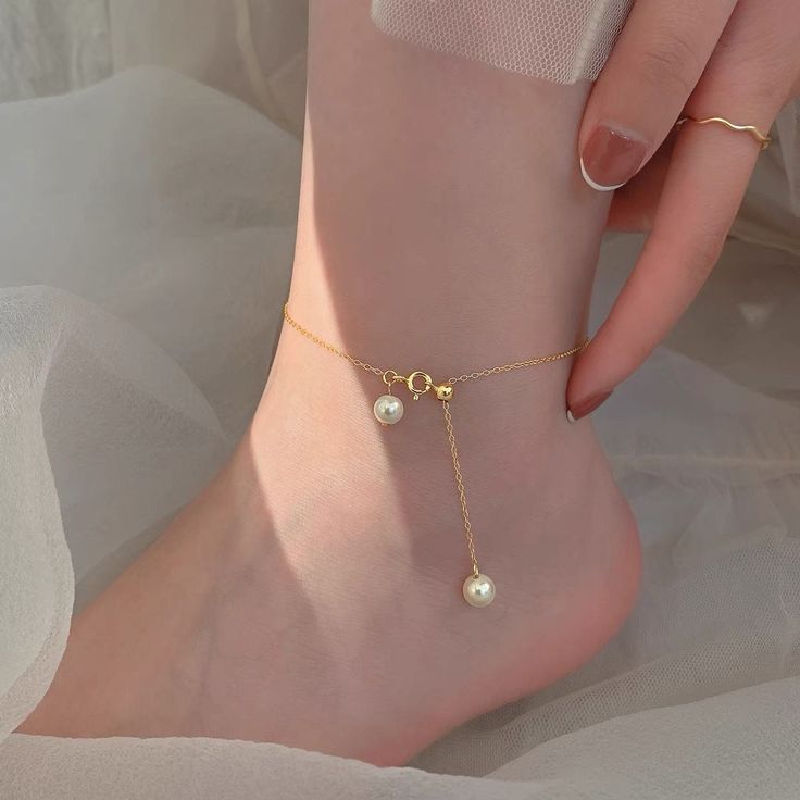 💖 This beautiful pearl anklet features  adorable freshwater pearl and makes a perfect gift for that special person in your life: mom, sister, daughter, in-law, bridesmaids, maid of honor, and more! ♥ This anklet made by AAAA luster high quality freshwater pearl. Simple and classic pearl anklet handmade with 14k gold filled chain. Also there is a 14K gold filled 4mm stopper bead (silicone inside) to make anklet adjustable up to 10 inches.  Materials - One AAAA-quality freshwater pearl with very high luster flawless surface. - Pearl size 6mm-7mm - Chains: 14K Gold Filled/ adjustable up to 10 inches - 4mm 14K Gold Filled stopper bead 14k gold filled jewelry benefits: 1. Anti-allergic unless you are allergic to gold. 2. Affordable alternative to real solid gold. 3. High quality for life long Gold Anklets With Pearl Charm As Gift, Gold Anklets With Pearl Charm For Gift, White Anklets With Pearl Charm As Gift, Gold Dainty Anklets With Pearl Charm, Dainty Gold Anklets With Pearl Charm, Gold Pearl Anklets As Gift, Gold Pearl Anklet With Pearl Charm, Gold Pearl Anklets For Gift, Dainty Pearl Gold Anklets