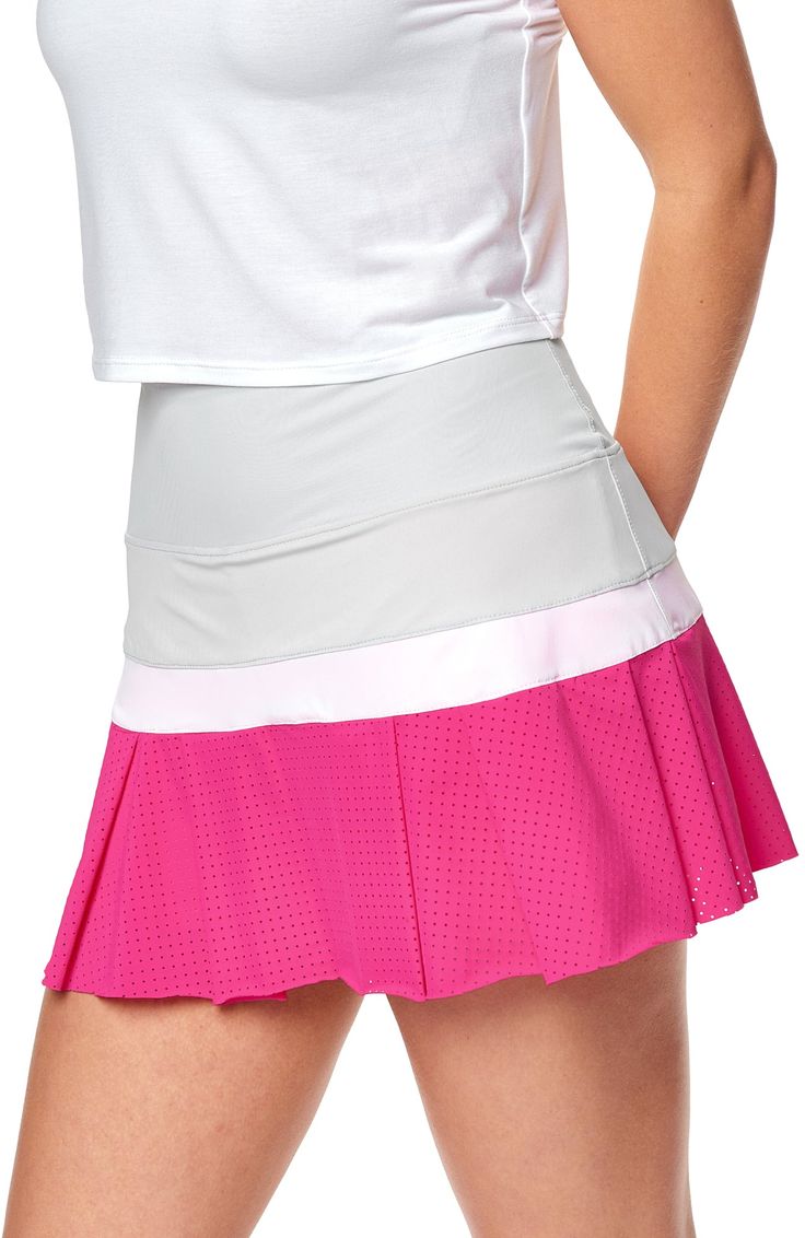 Color: Hot Pink Description: Serve up winners in the Baseline Color Block Skort! Featuring a flattering high waist and a pleated flounce made from our unique perforated fabric, this sporty chic skort has a comfy inner short and lightweight feel - truly a Bobbe Classic. Comfy inner short Designed & uniquely fit to flatter every size Color Block Design FIT True to size Model is 5’10” – she wears size S. Fabrication: •Ultra Light weight perforated performance fabric • Feminine soft mesh Performance: UVP 50+ • Quick dry • Lightweight and breathable • Easy Care • Wrinkle Free • Performance: UVP 50+ • Quick dry • Lightweight and breathable • Chlorine Resistant • Easy Care • Wrinkle Free • No Pilling Content: 73% Microfiber Nylon / 27% Lycra® Sporty Spring Tennis Skirt With Wide Waistband, Pleated Sports Shorts, Summer Athleisure Tennis Skirt With Wide Waistband, Sporty Spring Skirt With Wide Waistband, Summer Athleisure Skort With Wide Waistband, Spring Athleisure Skort With Wide Waistband, Athleisure Skort With Wide Waistband For Spring, Athleisure Skort With Wide Waistband For Summer, Sporty Summer Tennis Skirt With Wide Waistband