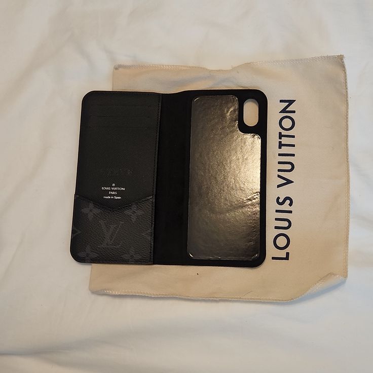 Gently Used Louis Vuitton Iphone X Phone Case. Only One Little Blemish On The Spine Of Case Pictured And Hot Stamped Name Removed. In Excellent Condition Comes From A Smoke Free Airpods Case Louis Vuitton, Louis Vuitton Pink Phone Case, Pink Lv Phone Case, Louis Vuitton Phone Case With Magnetic Closure, Used Louis Vuitton, Black Marble Phone Case, Cell Phone Accessories, Black And Grey, Louis Vuitton