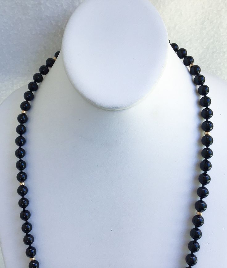 "A Truly Stunning Asian Hand Knotted Black Jade And 14k Beaded Necklace With A 10k Gold Charm From Wausau Attached Next To The 14k Interlocking Clasp In Superb Vintage Condition. The vintage statement necklace is all original and free of any damage of any kind. The black Jade beads are 1/4\" in diameter with hand knotting in between. The 14k gold beads measure 1/8\" in diameter. The 14k gold interlocking clasp is also marked with a hallmark of the maker. The necklace is 27\" in total length. Thi 14k Gold Single Strand Jewelry With Round Beads, Formal Yellow Gold Beaded Necklace, Formal Gold Beaded Necklaces, Gold Beaded Necklaces With Round Beads For Formal Occasions, Formal Necklace With Round Gold Beads, Elegant Rondelle Beads For Formal Occasion, Formal Round Jewelry With Gold Beads, Formal Hand-strung Jewelry, Elegant Formal Hand-strung Beads